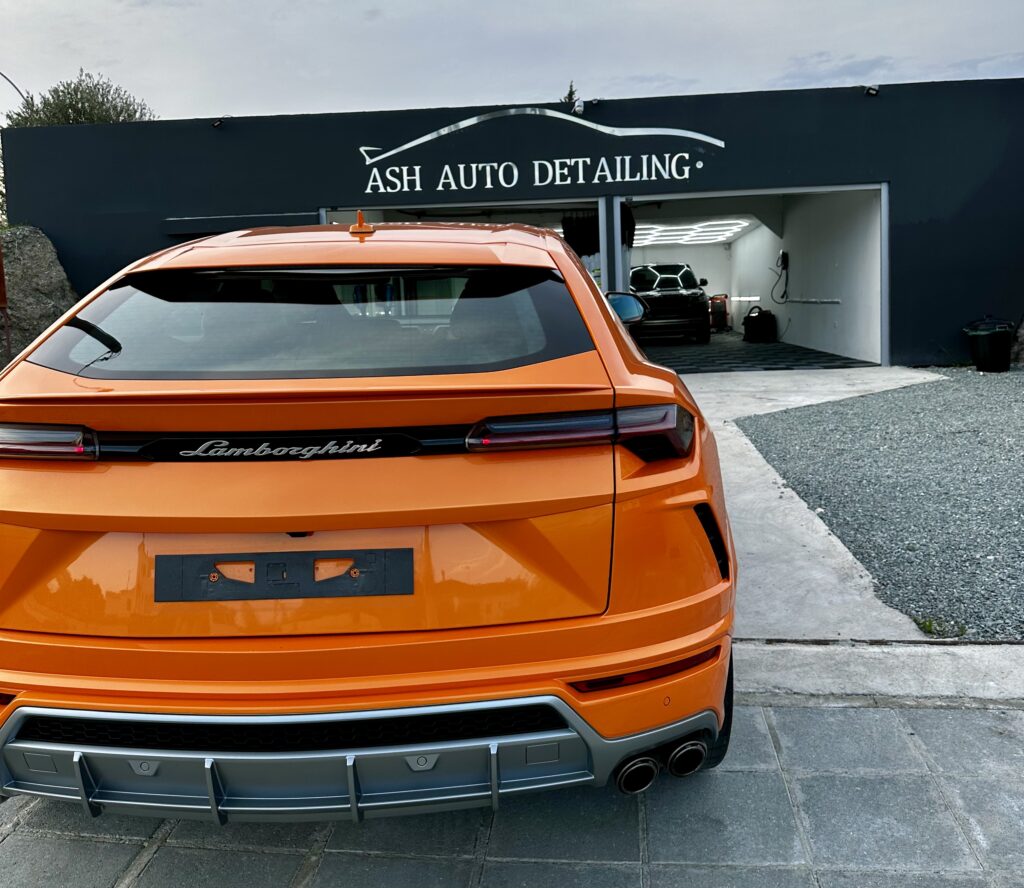 Lamborghini urus outside ash auto detailing shop, shop its on main road visible high end shop for luxury/supercars